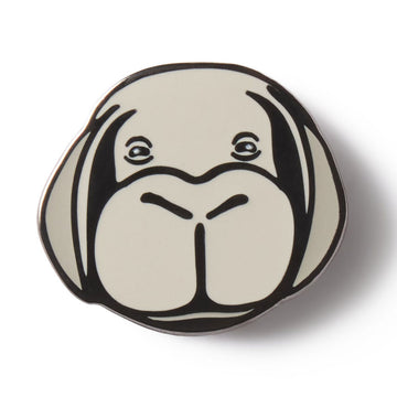 Round ceramic plate with a stylized dog face design on a white background